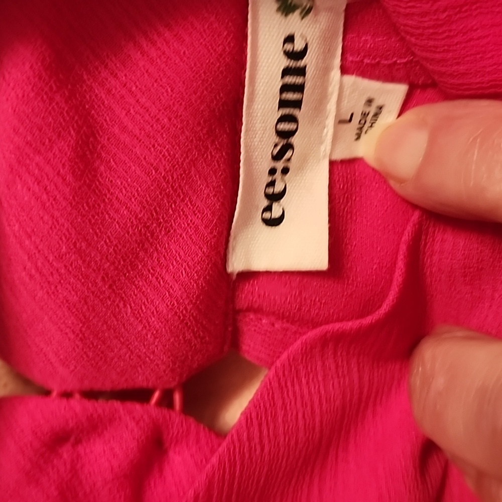 Beautiful fushia long sleeve with ruffles and cut out shoulder